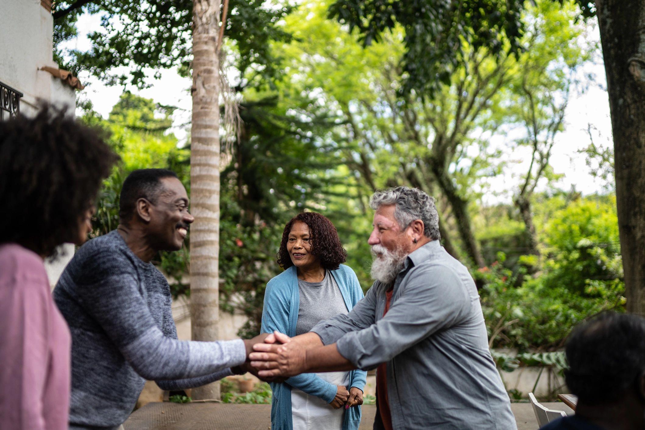 Neighbors talking outside a home