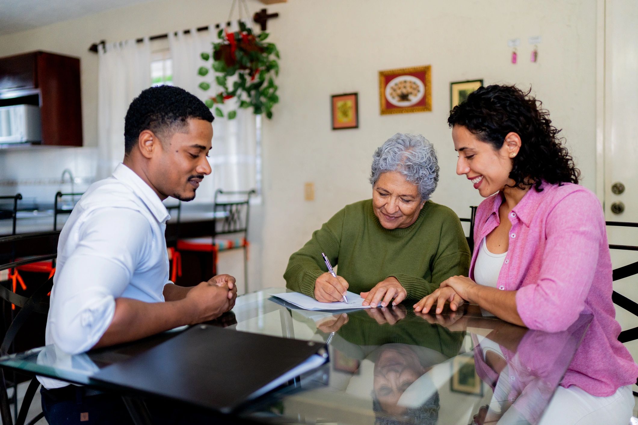 Family reviewing insurance documents together at home